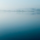 Calm reflective water surface, representing the settling of physical anxiety symptoms in the body