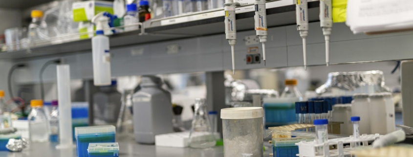 Laboratory bench with scientific equipment for pharmacogenomic testing