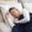 Person sleeping restfully in bed, illustrating sleep restoration in residential mental health care