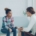 Therapist meeting with a young woman on a couch during a trauma-informed care session