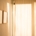 Warm daylight filtering through sheer curtains in a calm, private room, representing confidentiality in residential mental health treatment