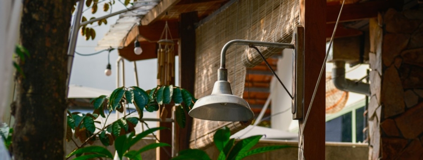 A sheltered outdoor patio with a warm lamp and green plants, suggesting a calm place to think through where to turn for mental health help