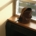 A packed backpack resting on a sunlit windowsill, ready for the trip home