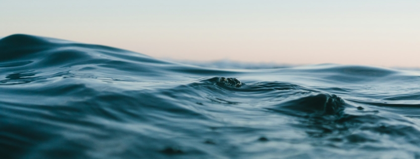 Peaceful ocean horizon at sunrise representing the calm environment of residential mental health treatment