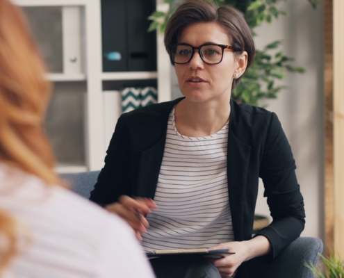 Clinician reviewing a treatment plan during a psychiatric hospital to residential mental health transition