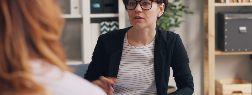 Clinician reviewing a treatment plan during a psychiatric hospital to residential mental health transition