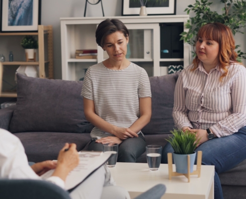 Small group therapy in residential treatment session with a facilitating clinician