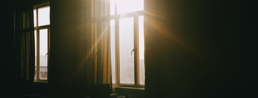 Quiet evening room with warm light, representing the calm structured environment of residential mental health care for treatment-resistant depression